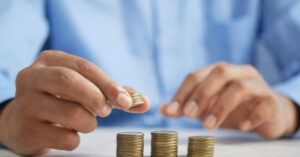 man counting coins